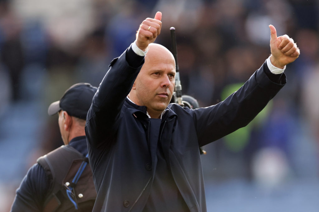 Arne Slot putting both thumbs up to Liverpool supporters during their game against Leicester City.