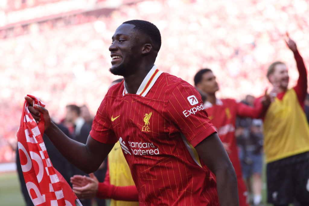 Ibrahima Konate celebrates following Liverpool winning the Premier League following the Reds' victory against Tottenham Hotspur at Anfield.