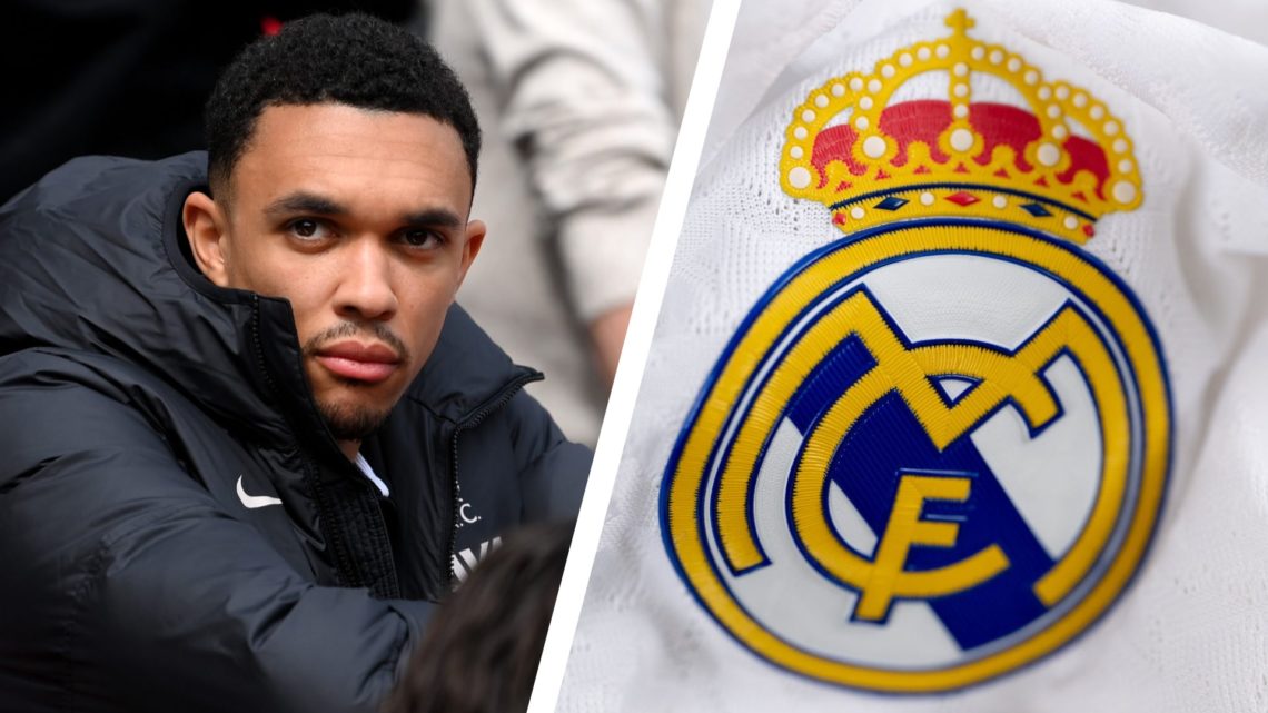 Trent Alexander-Arnold watches on from the Liverpool bench at Anfield. Real Madrid badge on home shirt.
