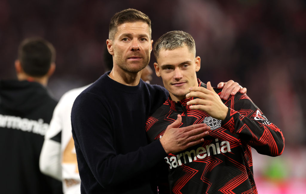 Bayer Leverkusen coach Xabi Alonso embraces Florian Wirtz after the Bundesliga match against Bayern Munich