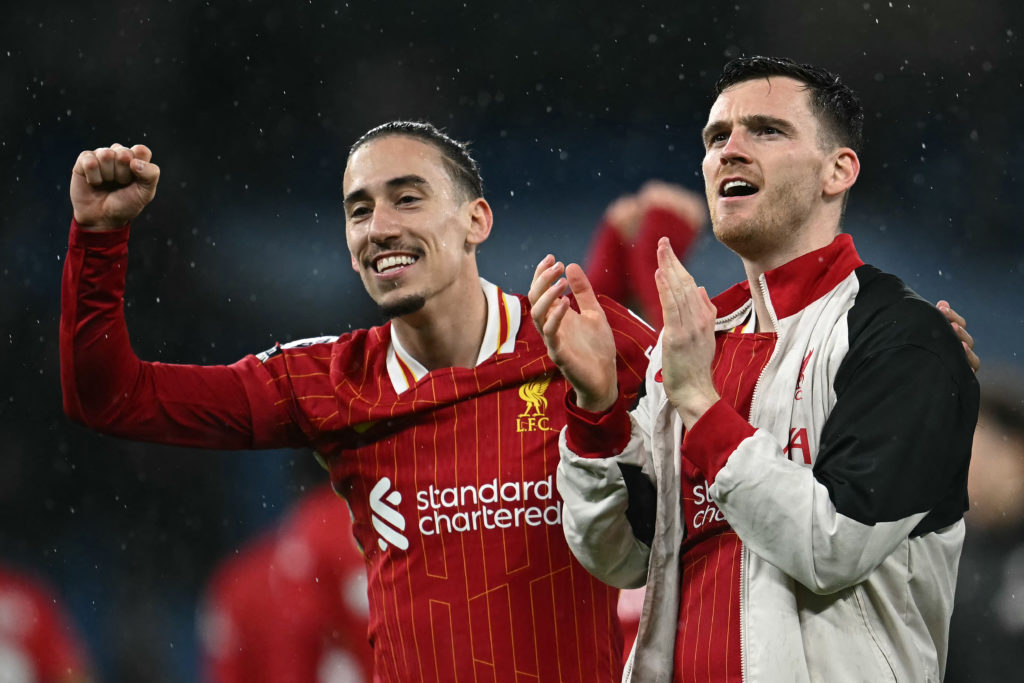 Andy Robertson and Kostas Tsimikas celebrating Liverpool's Premier League title win.