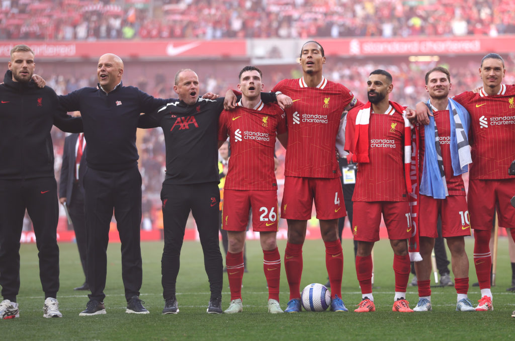 Liverpool's players and staff celebrating their Premier League title win.