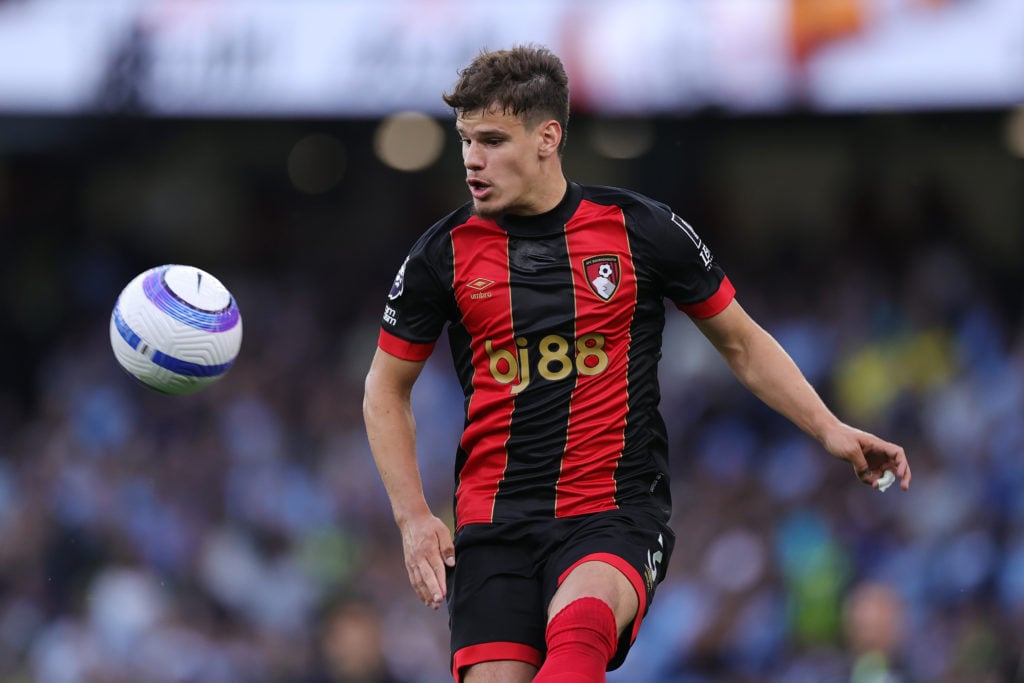 Milos Kerkez pictured playing for Bournemouth in a Premier League game against Manchester City.