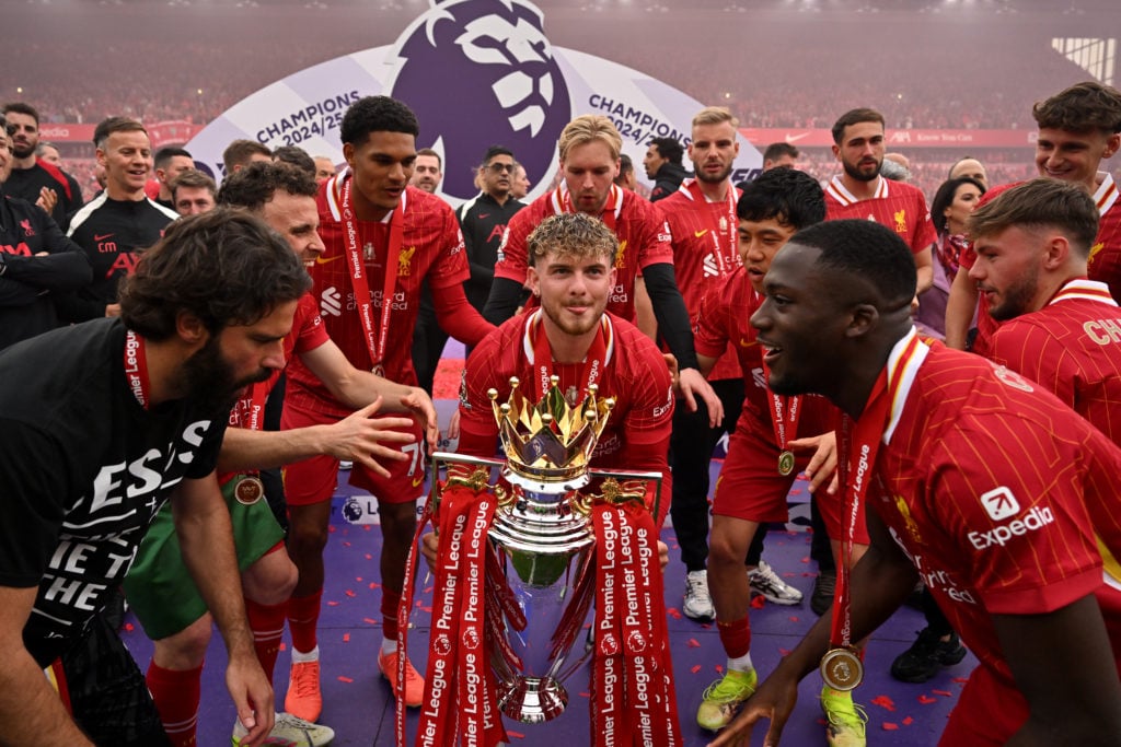 Harvey Elliott lifts the Premier League title after Liverpool have won it.