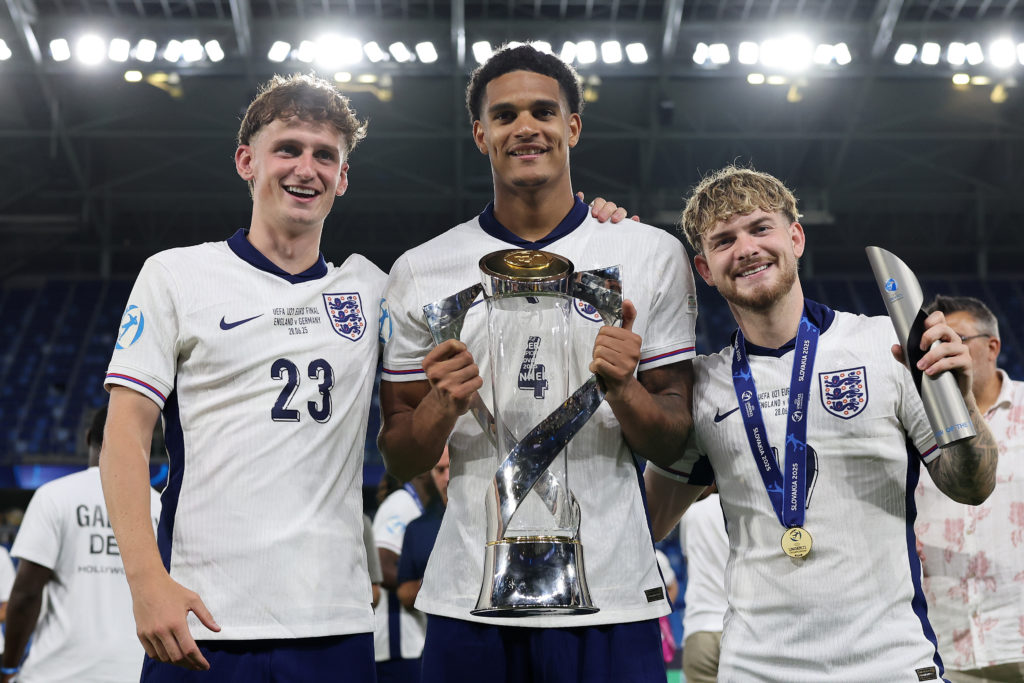 Harvey Elliott, Jarell Quansah and Tyler Morton posing with the Under-21 Euros trophy.