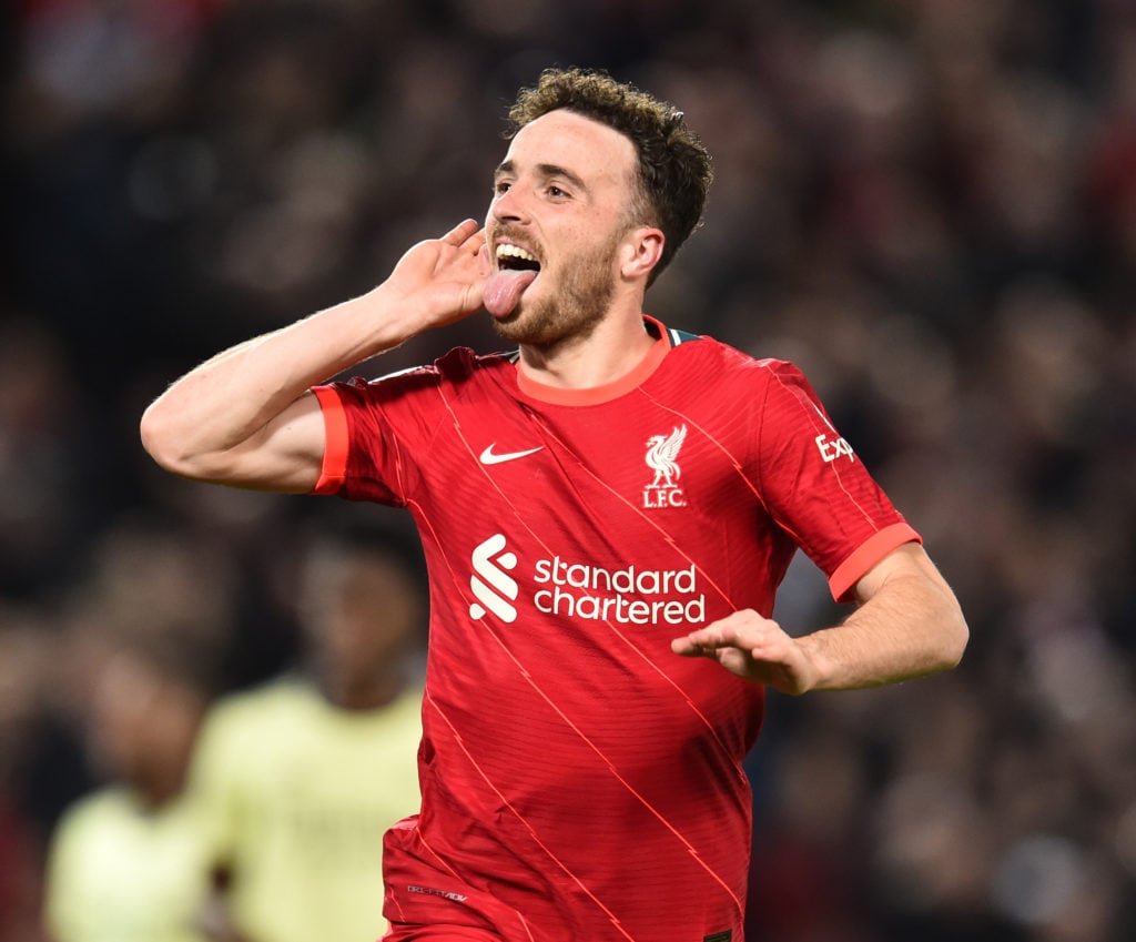 Diogo Jota celebrates in front of the Kop after scoring for Liverpool against Arsenal in the Premier League.