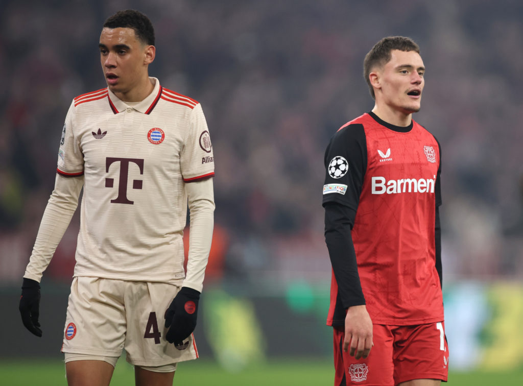 Jamal Musiala and Florian Wirtz look on during the UEFA Champions League match between Bayern Munich and Bayer Leverkusen at the Allianz Arena.