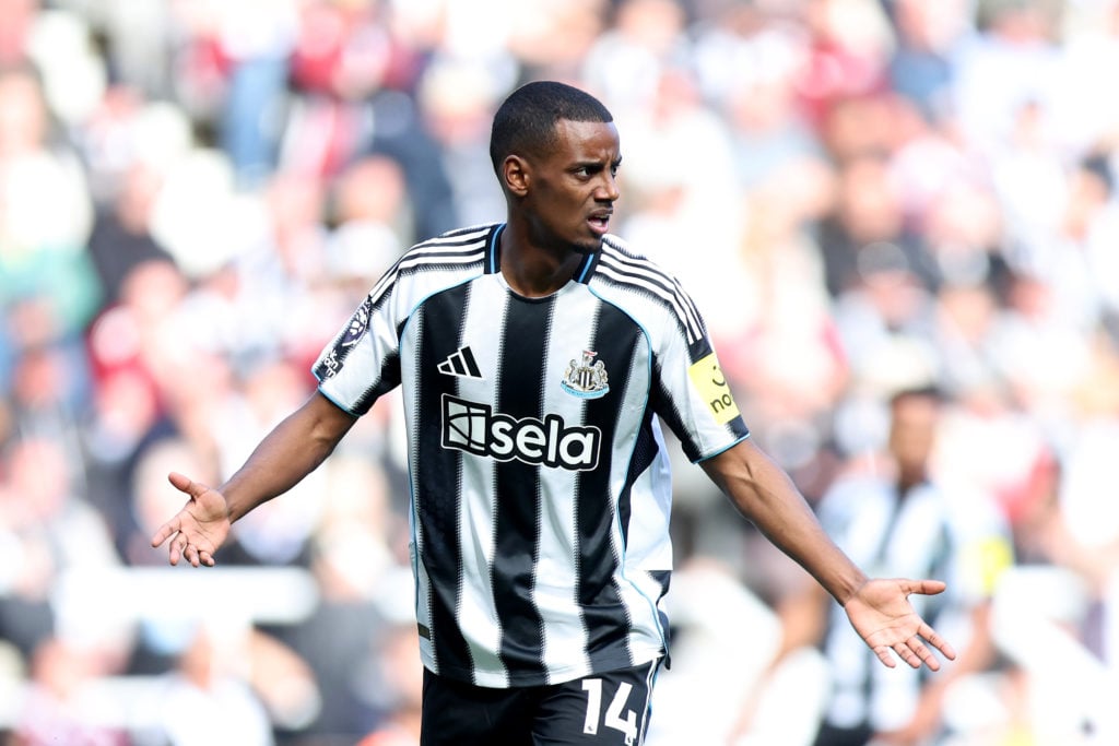 Alexander Isak gestures to teammates during Newcastle United's Premier League match against Everton at St James' Park.