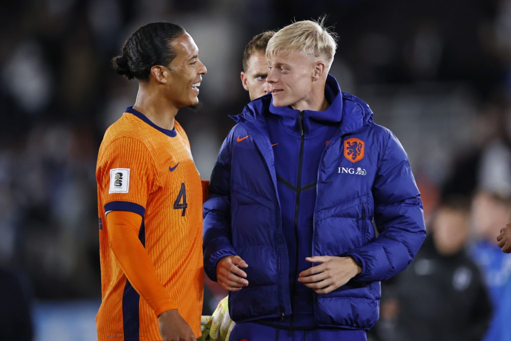 Netherlands teammates Virgil van Dijk and Jan Paul van Hecke laugh together at the full-time whistle of the FIFA World Cup qualifier against Finland in Helsinki