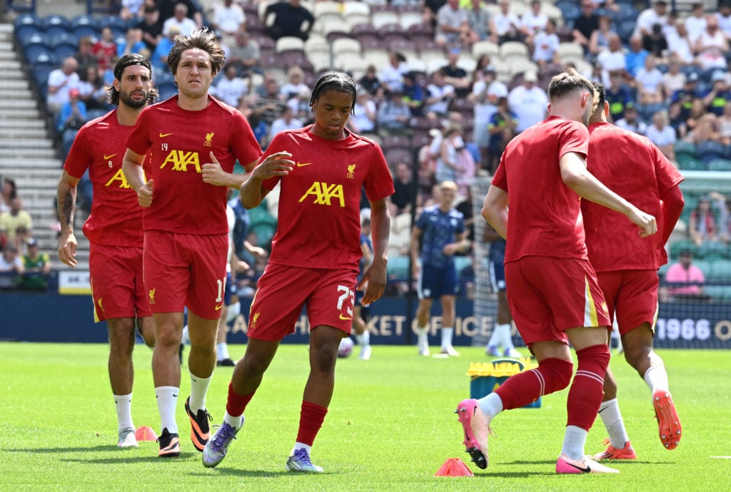 Liverpool players including Rio Ngumoha warm up ahead of the pre-season friendly against Preston North End at Deepdale.