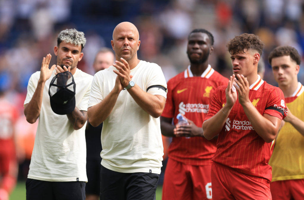 Arne Slot, Milos Kerkez and Luis Diaz applaud Liverpool fans after the pre-season friendly against Preston North End at Deepdale.