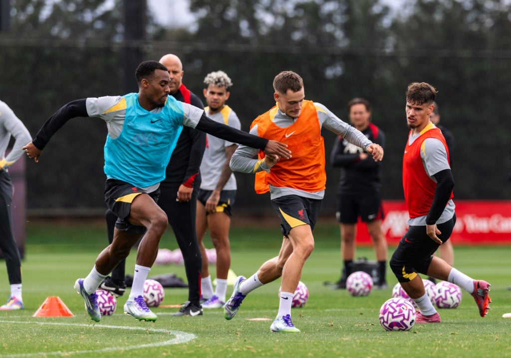 Florian Wirtz challenges Ryan Gravenberch for the ball during a Liverpool training session at the AXA Training Centre.