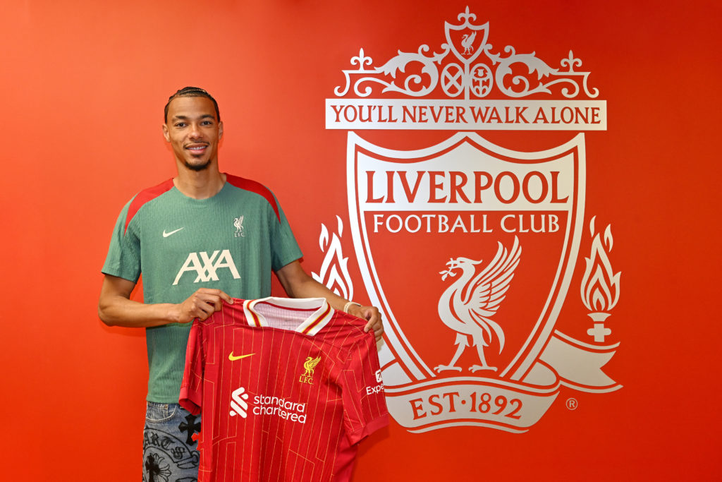 Hugo Ekitike poses for photos after he signs for Liverpool Football Club