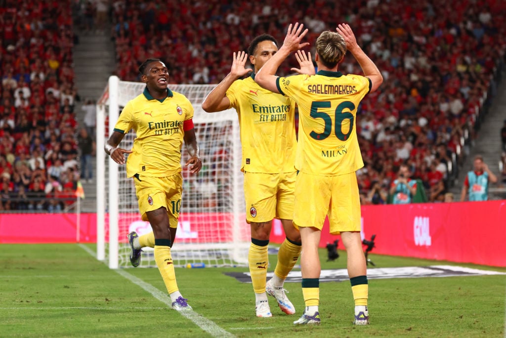 Noah Okafor of AC Milan celebrates with Alexis Saelemaekers after scoring the his team's third goal during the Pre-Season Friendly match between Liverpool FC and AC Milan at Kai Tak Sports Park