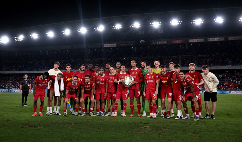 Liverpool players pose with the J. League World Challenge trophy after beating Yokohama F. Marinos in pre-season