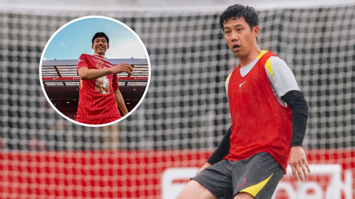 Wataru Endo passes the ball during a pre-season training session with Liverpool. Wataru Endo smiles in front of the Kop as he celebrates winning th...
