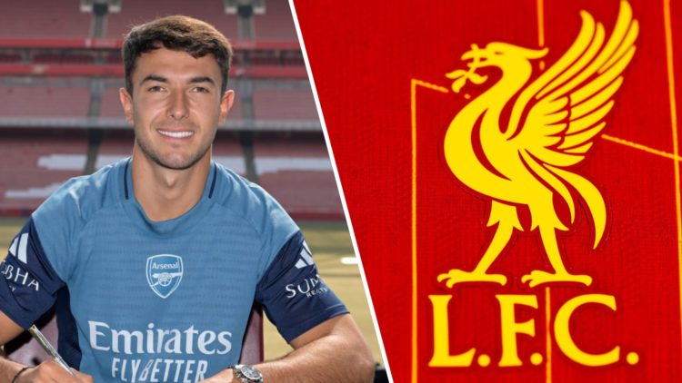 Martin Zubimendi smiles as he signs in as a new Arsenal player at the Emirates Stadium. Liverpool crest pictured on the 2024/25 home shirt.