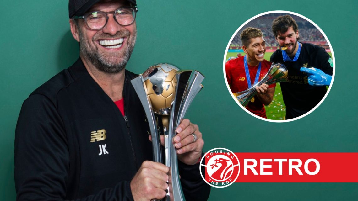 Jurgen Klopp smiles as he holds the Club World Cup after winning it with Liverpool in Qatar. Roberto Firmino and Alisson Becker of Liverpool hold t...