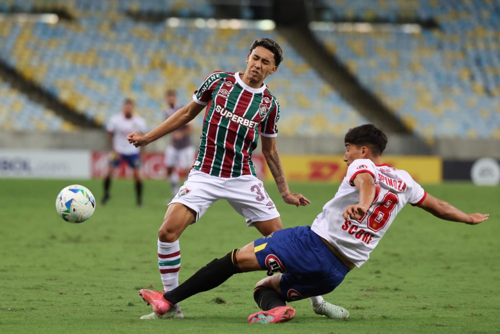 Isaque of Fluminense rides a challenge during the Copa CONMEBOL Sudamericana match against Union Espanola
