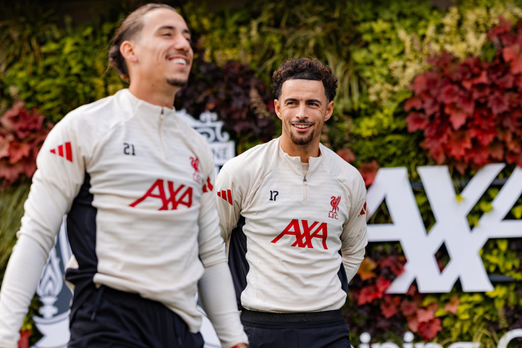 Curtis Jones and Kostas Tsimikas walk out for Liverpool training at the AXA Training Centre.