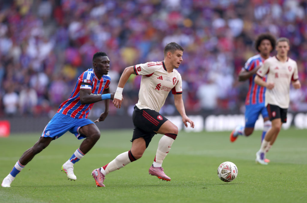 Milos Kerkez runs with the ball during Liverpool's Community Shield clash against Crystal Palace at Wembley