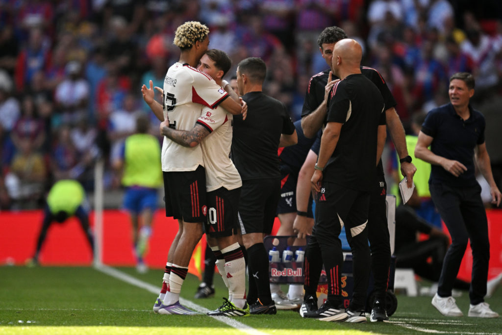 Hugo Ekitike hugs Alexis Mac Allister as he is substituted during Liverpool's Community Shield clash against Crystal Palace at Wembley.