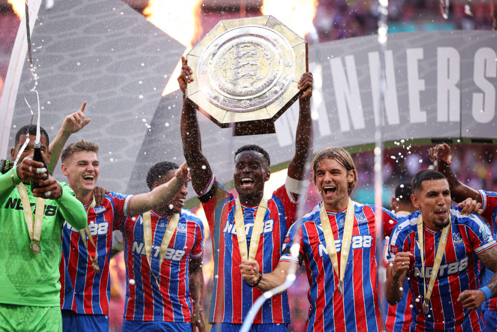 Marc Guehi lifts the Community Shield as Crystal Palace players celebrate following their penalty shootout victory over Liverpool