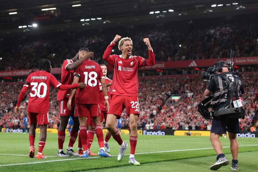 Hugo Ekitike celebrates with the Anfield crowd after scoring against Bournemouth in the Premier League.
