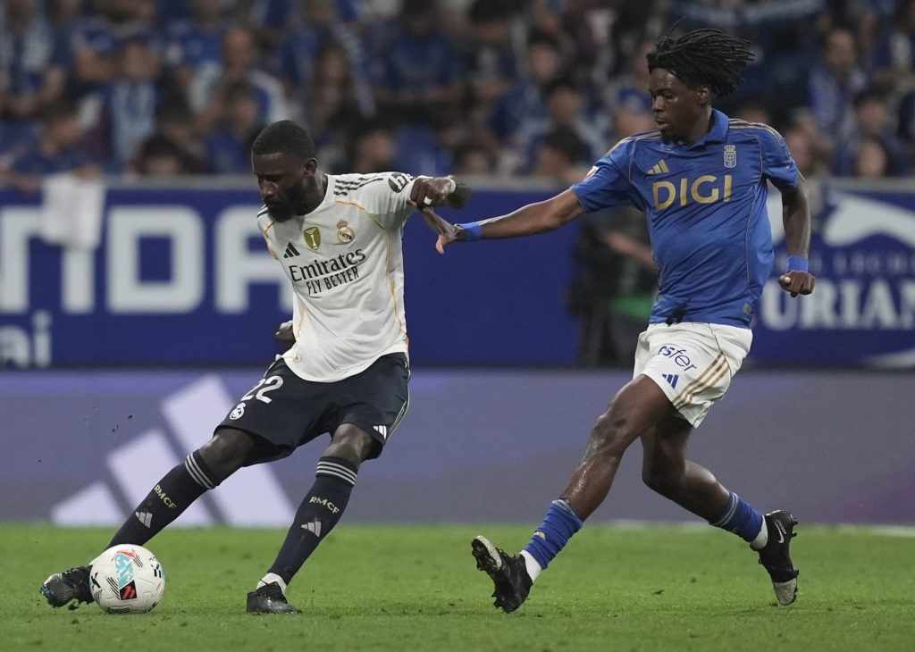 Real Madrid defender Antonio Rudiger clears the ball under pressure from Real Oviedo midfielder Ovie Ejaria during a La Liga match