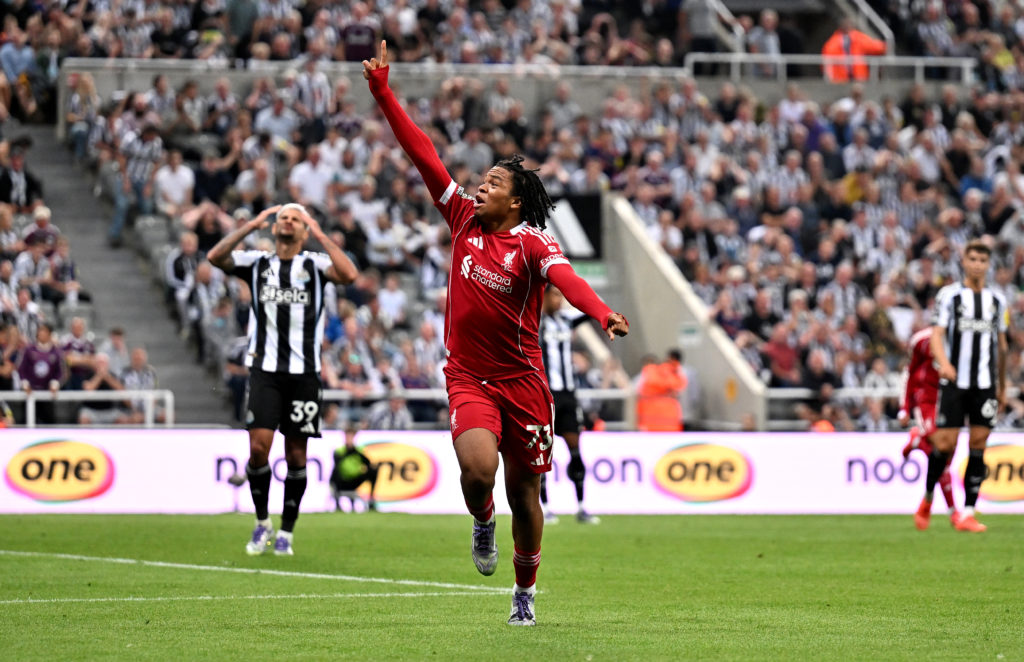 Rio Nugmoha points to the Liverpool fans after scoring against Newcastle United at St James' Park.