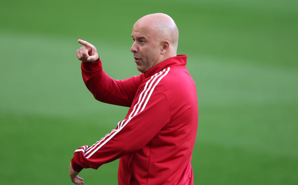 Arne Slot pictured pitchside before Liverpool's Premier League match against Newcastle United at St James' Park.