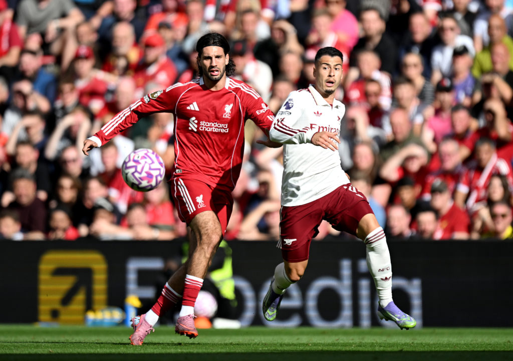 Dominik Szoboszlai and Gabriel Martinelli battle for the ball during Liverpool's Premier League match against Arsenal