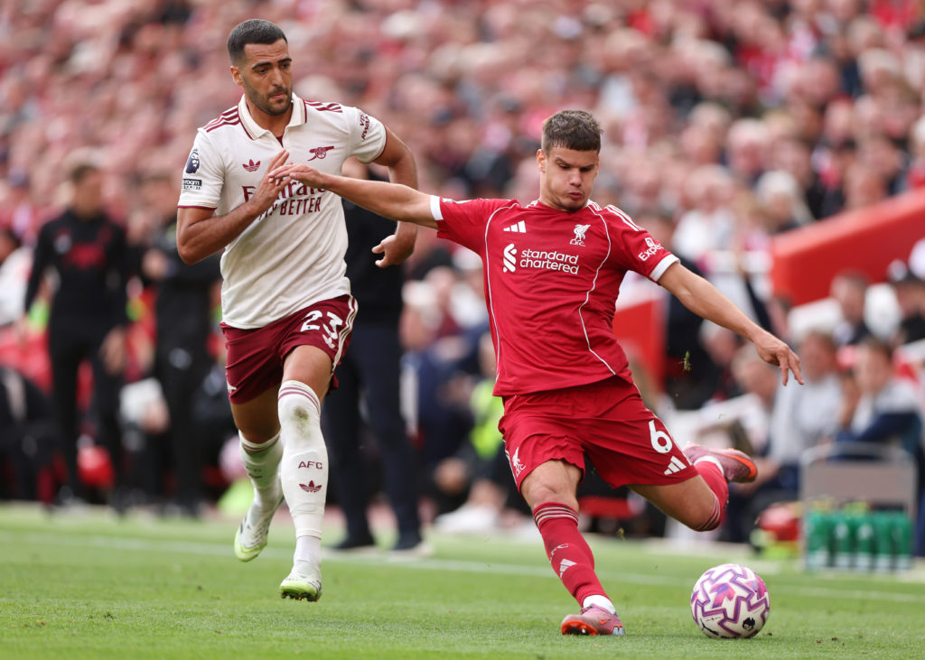 Milos Kerkez of Liverpool crosses the ball during the Premier League match between Liverpool and Arsenal at Anfield