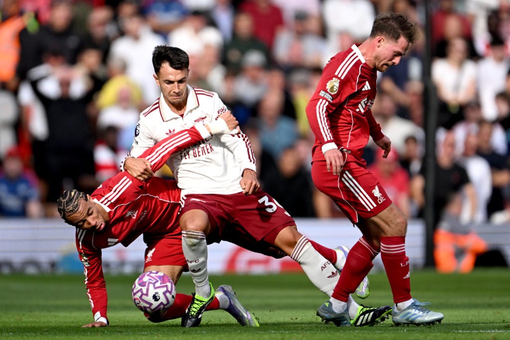 Martin Zubimendi challenges for the ball with Hugo Ekitike during Arsenal's Premier League match against Liverpool at Anfield.