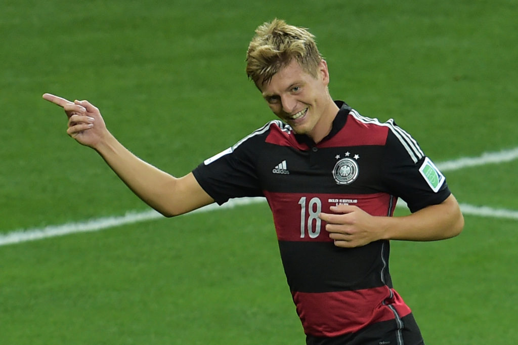 Germany's midfielder Toni Kroos celebrates after he scored his team's third goal during the semi-final football match between Brazil and Germany at The Mineirao Stadium