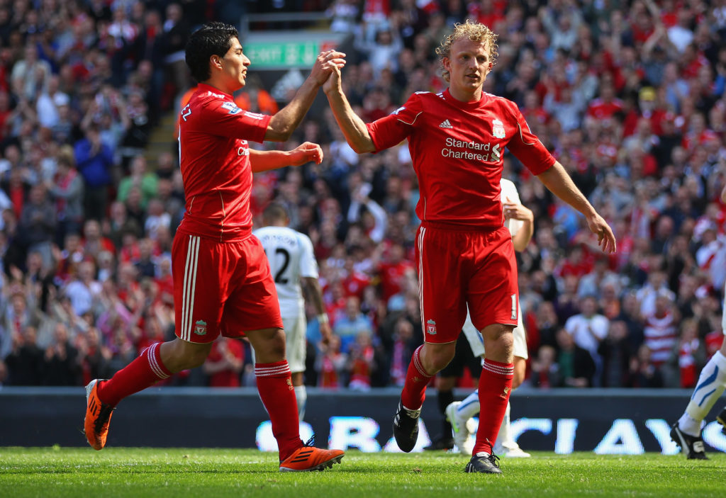 Dirk Kuyt of Liverpool celebrates with team mate Luis Suarez after scoring the second goal from the penalty spot during the Barclays Premier League match between Liverpool and Newcastle United at Anfield