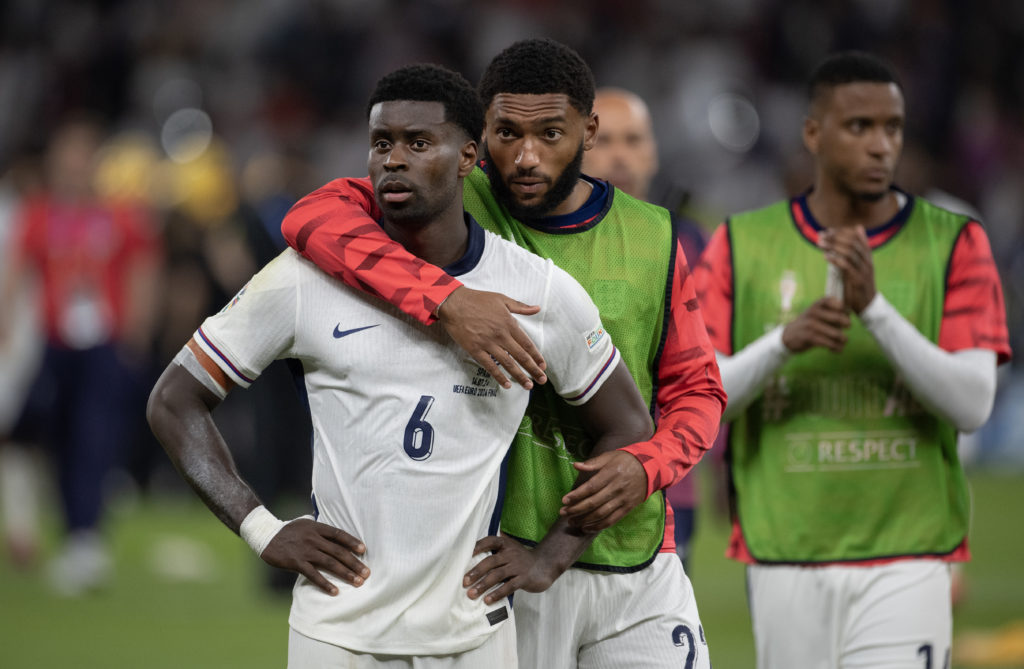 Marc Guehi of England looks dejected with teammate Joe Gomez following the UEFA EURO 2024 final match between Spain and England at Olympiastadion.