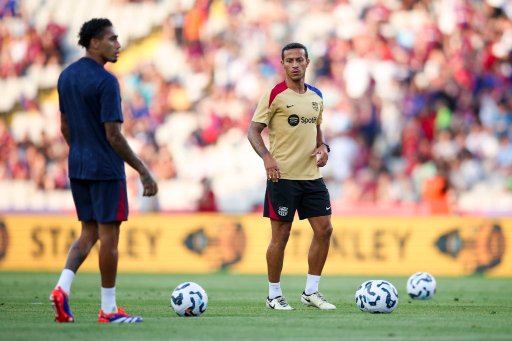 Thiago Alcantara helps with the warm-up ahead of Barcelona's pre-season friendly against AS Monaco