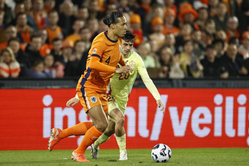 Virgil van Dijk and Pedri jostle for the ball during the Netherlands' UEFA Nations League match against Spain in Rotterdam