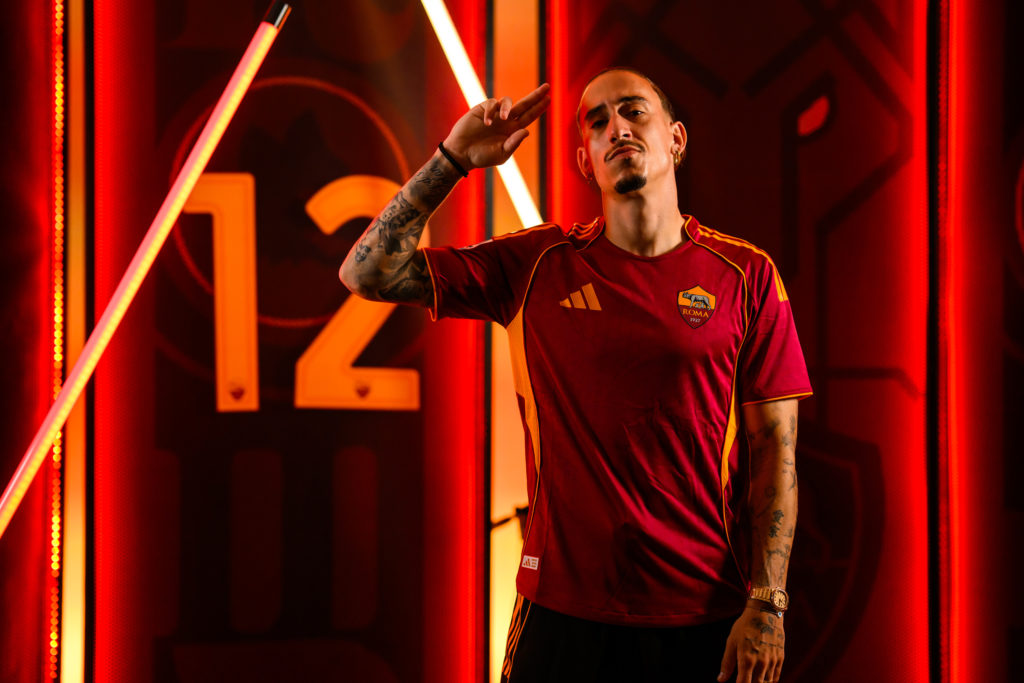 Kostas Tsimikas poses for the camera after being unveiled as a new AS Roma signing on loan from Liverpool.