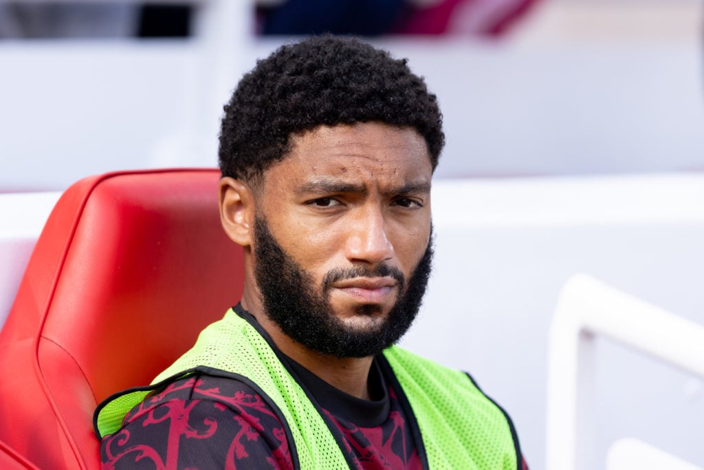 Joe Gomez looks on from the substitutes bench during the Premier League match against Arsenal at Anfield.