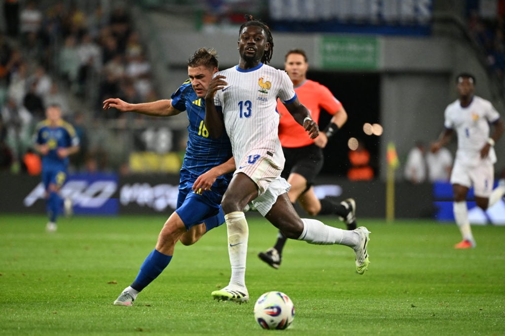 Manu Kone of France battles for the ball with Ukraine's Yehor Yarmoliuk during the FIFA World Cup qualifier in Wroclaw, Poland.