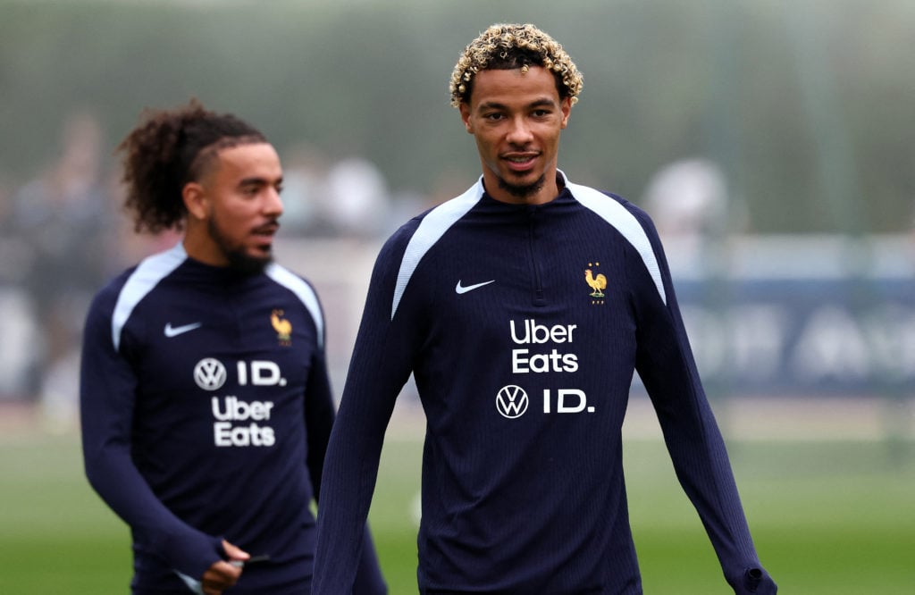 France's forward Hugo Ekitike (R) attends a training session at the team's training grounds in Clairefontaine-en-Yvelines.
