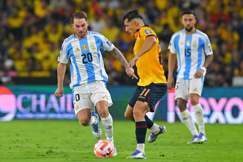 Argentina's midfielder #20 Alexis Mac Allister and Ecuador's midfielder #21 Alan Franco fight for the ball during the 2026 FIFA World Cup South American qualifiers football match between Ecuador and Argentina