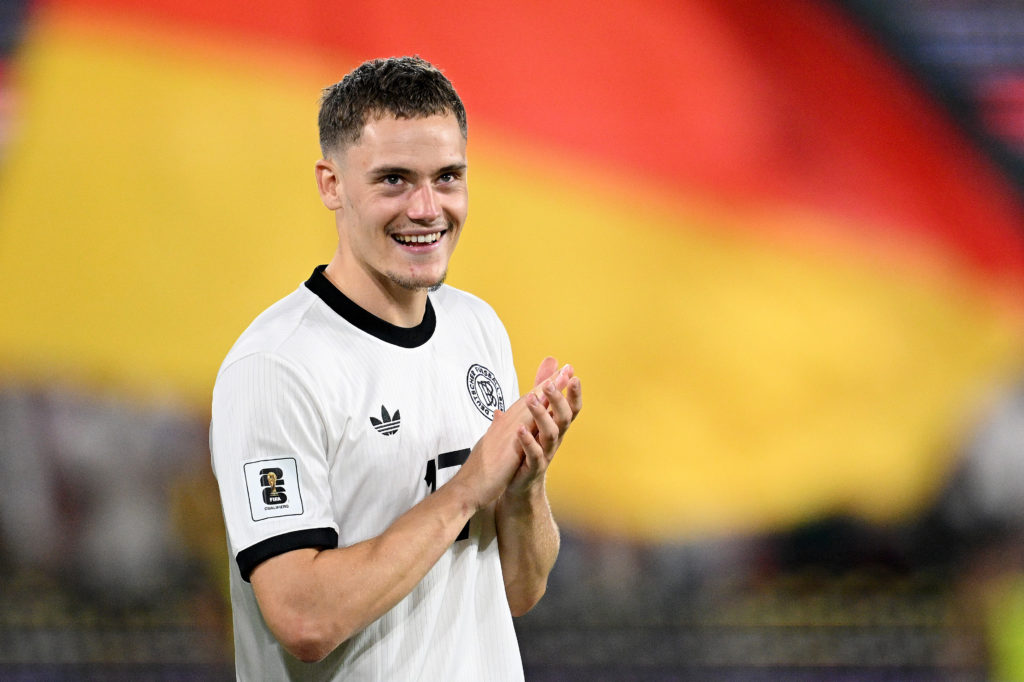 Florian Wirtz smiles and applauds after Germany's FIFA World Cup qualifying win over Northern Ireland in Cologne.