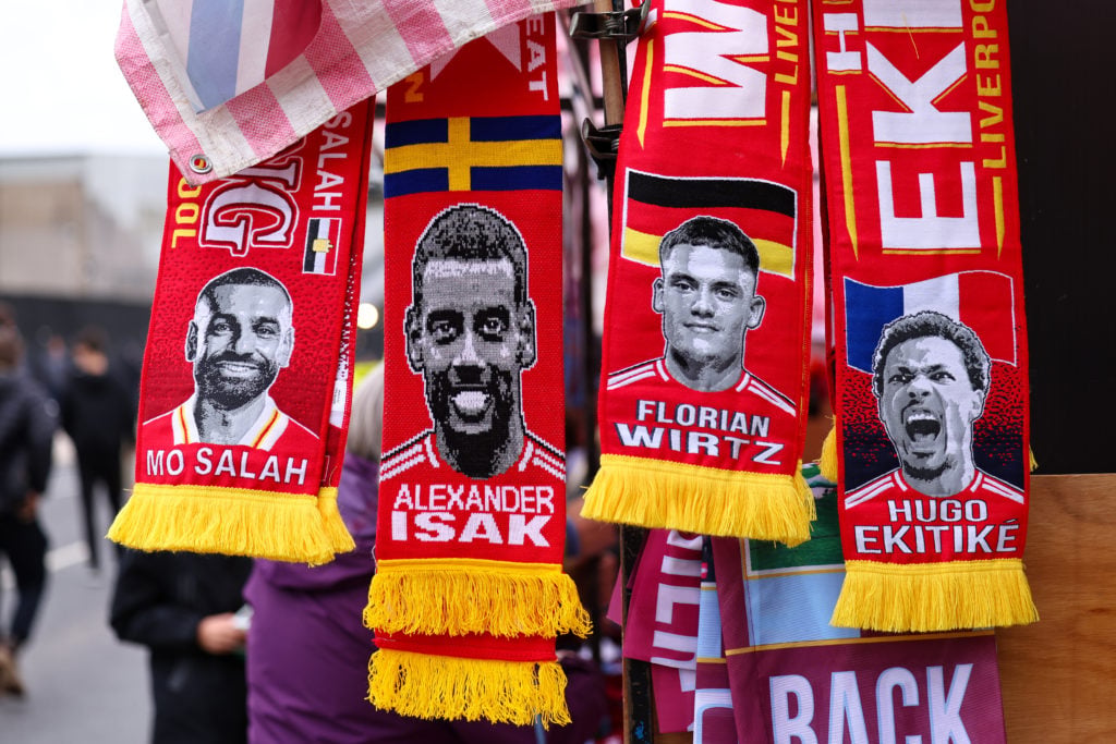 Merchandise scarves featuring Hugo Ekitike, Florian Wirtz, Alexander Isak and Mohamed Salah of Liverpool been sold at a stall ahead of the Premier League match between Burnley and Liverpool at Turf Moor.