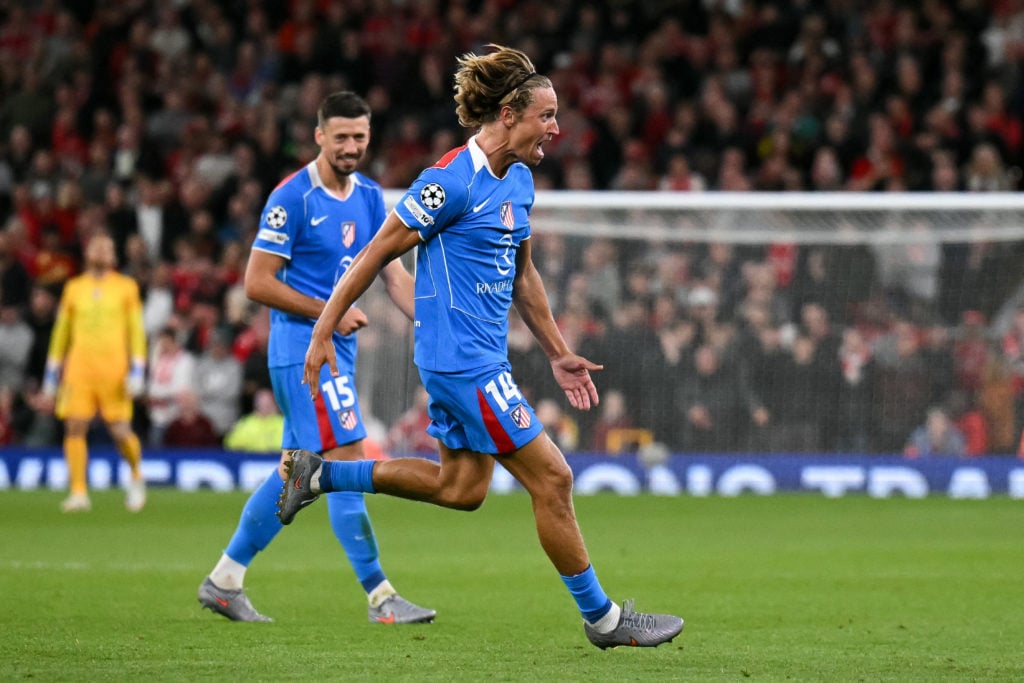 Marcos Llorente celebrates after scoring for Atletico Madrid in the UEFA Champions League against Liverpool at Anfield.