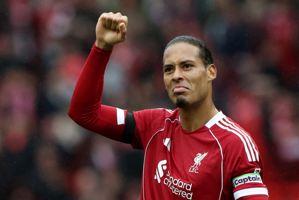Virgil van Dijk raises a first in celebration after Liverpool's Premier League win over Everton at Anfield.