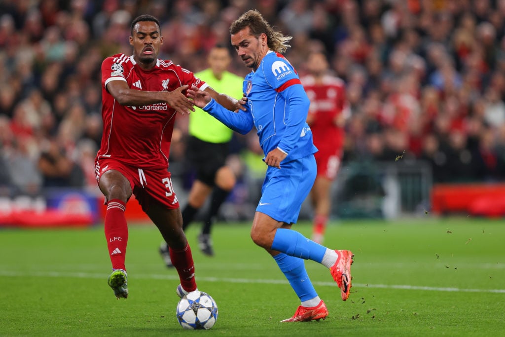 Antoine Griezmann of Atletico Madrid battles for possession with Ryan Gravenberch of Liverpool during the UEFA Champions League 2025/26 League Phase MD1 match between Liverpool FC and Atletico de Madrid.