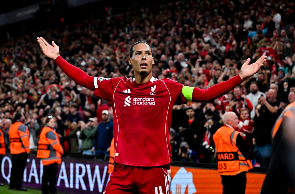 Virgil van Dijk celebrating after scoring the third goal during the UEFA Champions League 2025/26 League Phase MD1 match between Liverpool FC and Atletico de Madrid at Anfield.